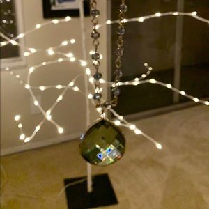 Long necklace in green blue hue glass pendant